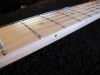 Pocketed fret slots.